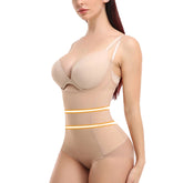 Woman wearing a beige bodysuit with visible COMFREE branding on a white background.